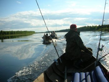 Boat fishing in Muonio river.