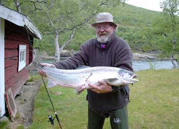 H.C. Andersen with 11 kg Tana salmon he caught the salmon on camp Levajok