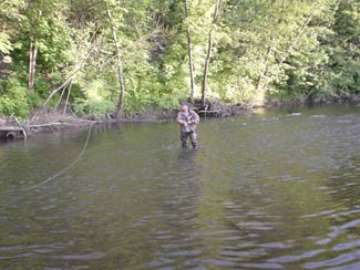 William tries, fishing luck at the low water in summer. Photo: Wojtech Sargalski