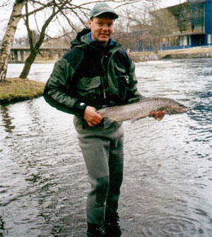 Kim to visit, with sea trout catch