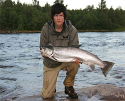 Oskar Andersson with a totally blank Gullspångs salmon Weight: 8,8 kg caught June 28. 2007. Photo: Johnny Hansen